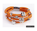 Oranje leren armband met zilveren met bloemetje. NBNNSB340